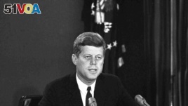 President John F. Kennedy makes a national television speech October 22, 1962, from Washington. He announced a naval blockade of Cuba until Soviet missiles are removed. (AP Photo)