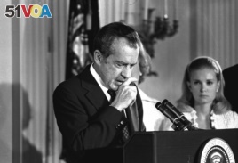 FILE - Richard Nixon says farewell to his Cabinet, aides, and staff on August 9, 1974.