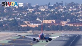 FILE - A Southwest Airlines plane approaches to land at San Diego International Airport. Wireless companies in the U.S. said they would delay the start of high-speed 5G service near some airports after warnings from airlines of possible disruptions. (REUTERS/Mike Blake/File)