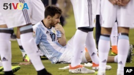 Argentina's Lionel Messi waits for trophy presentations after the Copa America Centenario championship soccer match, Sunday, June 26, 2016, in East Rutherford, N.J.