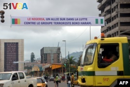 FILE - A banner reads 'Nigeria - an ally in the fight against terrrorist group Boko Haram' in Yaounde, Cameroon, July 28, 2015.