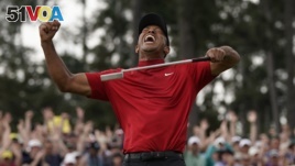 Tiger Woods reacts as he wins the Masters golf tournament Sunday, April 14, 2019, in Augusta, Ga. 