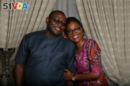 Oladipupo Baruwa, (left) and his wife Funke pose for a photograph at home in Abuja, Nigeria, Feb. 2018. Baruwa said, 