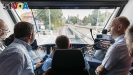 Officials ride the new Coradia iLint hydrogen-powered train that recently launched in northern Germany. (Ren<I>&#</i>233; Frampe/Alstom)