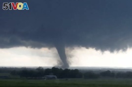 This image taken from a car window shows a tornado in Oklahoma, May 9, 2016.