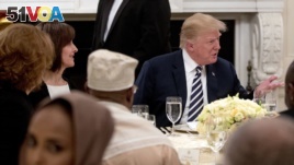 President Donald Trump sits down for an iftar dinner, which breaks a daylong fast, celebrating the Islam's holy month of Ramadan, in the State Dining Room of the White House, June 6, 2018, in Washington. 