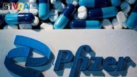 FILE - A Pfizer logo is placed near medicines from the same manufacturer in this illustration taken September 29, 2021. (REUTERS/Dado Ruvic/Illustration/File Photo)