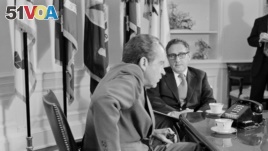 In this Oct. 9, 1973 file photo, President Richard M. Nixon meets Secretary of State Henry Kissinger in the Oval Office of the White House in Washington DC.