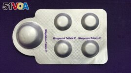 FILE - This image, courtesy of Plan C, shows a combination pack of mifepristone, left, and misoprostol tablets, two medicines used together to induce abortion, May 8, 2020.