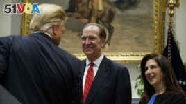 President Donald Trump greets David Malpass, under secretary of the Treasury for international affairs, and his wife Adele, after announcing his nomination to head the World Bank, during an event in the Rosevelt Room of the White House, Feb. 6, 2019, in W