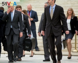 Former Virginia Gov. Bob McDonnell, left, with his wife Maureen McDonnell, right, leave the Supreme Court last year.