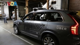 In this file photo, an Uber driverless car is shown in a garage in San Francisco, Dec. 13, 2016.