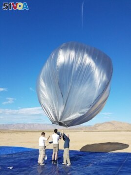 One of the balloons is being prepared for flight soon after the 2019 Ridgecrest earthquake activity. The balloons were launched from California's Mojave Desert and allowed to pass over the area. (Photo Credit: NASA/JPL-Caltech)
