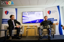 Keith Maxwell, Senior Product Manager of Exoskeleton Technologies at Lockheed Martin, right, speaks alongside Paul Scharre, Senior Fellow and Director of the Technology and National Security Program at the Center for a New American Security.