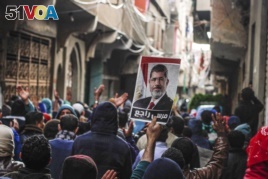 FILE -- In this Jan. 25, 2016 file photo, supporters of ousted Islamist President Mohamed Morsi