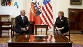 U.S. Vice President Mike Pence chats with Chile's President Michelle Bachelet in Santiago, Chile, Aug. 16, 2017.