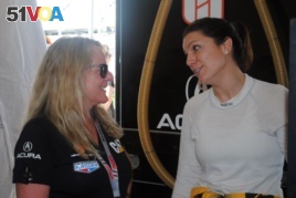 Team owner Jackie Heinricher, left, talks with Katherine Legge, of England, during a test session at Daytona International Speedway in Daytona Beach, Florida, January 4, 2019. (AP Photo/Mark Long)