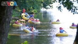A group of friends enjoy a day of tubing at James River State Park.