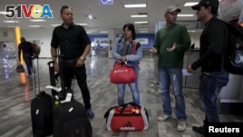 Cuban migrants arrive after traveling en route from Costa Rica to El Salvador, Guatemala and Mexico, before heading to the U.S., at General Lucio Blanco International airport in Reynosa, in Tamaulipas state, Mexico, Jan. 17, 2016.  