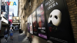 FILE - Broadway posters outside the Richard Rodgers Theatre in New York on May 13, 2020. (Photo by Evan Agostini/Invision/AP, File)