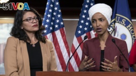 In this July 15, 2019, file photo, U.S. Rep. Ilhan Omar, right, speaks, as U.S. Rep. Rashida Tlaib listens, during a news conference at the Capitol in Washington, D.C. (AP Photo/J. Scott Applewhite, File)