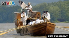 Re-enactors of the Corps of Discovery retrace the steps of Lewis and Clark. (AP Photo/Mark Duncan)