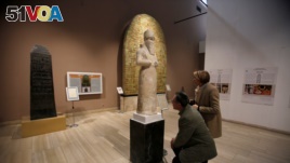 Participants in the Antiquities Protection Workshop look a King Shalmaneser III statue, while learning to counter heritage crimes and trafficking of artifacts, at the Iraqi National Museum in Baghdad, Iraq, Jan. 23, 2019. 