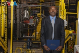 Julius Wakam with his Controls Technician certificate at the Aug. 8, 2018, graduation ceremony at Macomb Community College's M-TEC facility in Warren, Michigan.