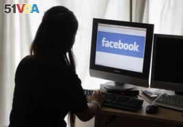 A young California woman takes a look at Facebook in this file photo.