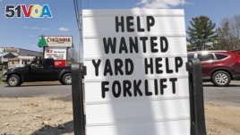 A help wanted sign is posted outside Cyr Lumber in Windham, N.H., Thursday, May 7, 2020. (AP Photo/Charles Krupa)