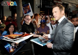 Actor Chris Pratt signs autographs at the world premiere of Marvel Studios' 