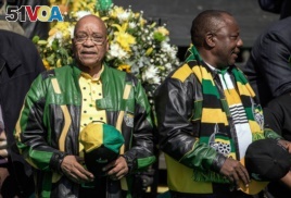 In this file photo taken on July 31, 2016 South African ruling party African National Congress (ANC) president Jacob Zuma (L) and deputy Cyril Ramaphosa arriving for an ANC rally