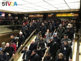 Commuters exit the New York Port Authority in New York City, U.S. Dec. 11, 2017 after reports of an explosion.
