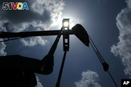 Oil is pumped from a well near Van, Texas. The U.S. made its first export of crude oil from Texas last Thursday.(AP)    