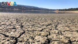 A dry bed is seen at Lake Mendocino near Ukiah, Calif., Wednesday, Aug. 4, 2021. The town of Mendocino gets some of their water from this water supply, but most of the lake water goes to Sonoma County. (AP Photo/Haven Daley)