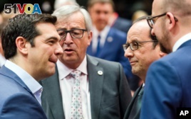 Greek Prime Minister Alexis Tsipras, left, speaks with, from left, European Commission President Jean-Claude Juncker, French President Francois Hollande and Belgian Prime Minister Charles Michel during a meeting of eurozone heads of state at the EU Council building in Brussels on Sunday, July 12, 2015. (AP Photo/Geert Vanden Wijngaert)