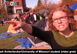 University of Missouri communications professor Melissa Click is seen in a screenshot from a video shot by University of Missouri student photographer Mark Schierbecker, telling the photographer he 