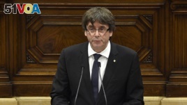 Catalan regional government president Carles Puigdemont gives a speech at the Catalan regional parliament in Barcelona, Oct. 10, 2017.