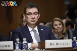 FILE - In this Feb. 26, 2019 file photo, Albert Bourla, chief executive officer of Pfizer, prepares to testify before the Senate in Washington, DC.
