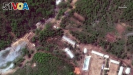 FILE - This Wednesday, May 23, 2018 satellite file image provided by DigitalGlobe, shows the Punggye-ri test site in North Korea. North Korea has carried out what it says is the demolition of its nuclear test site in the presence of foreign reporters.