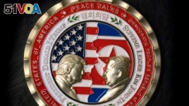  A coin for the upcoming US-North Korea summit is seen in Washington, DC, on May 21, 2018.
