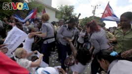 Members of The Ladies in White, an opposition group are detained from Cuban security personnel. (File)