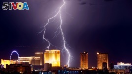 Lightning strikes behind Las Vegas Strip casinos as a thunderstorm passes through Las Vegas, Nevada, U.S. September 13, 2017. 