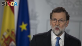 Spain's Prime Minister Mariano Rajoy speaks during a news conference in Madrid, Spain, Friday, Dec. 22, 2017. Catalonia's secessionist parties won enough votes Thursday to regain a slim majority in the regional parliament and give new momentum to their po