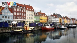 In this file photo, boats are anchored in the Nyhavn district of Copenhagen, Denmark, Dec. 5, 2009. Global watchdog Transparency International said Wednesday its latest annual Corruption Perceptions Index report Denmark and New Zealand performed best in 2016.