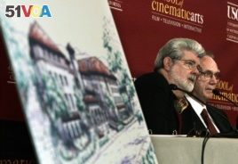 Former University of Southern California student and film director George Lucas, left, and USC president Steven Sample talk with reporters before the ceremonial groundbreaking for a new building at the USC School of Cinematic Arts.