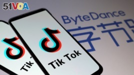 TikTok logos are seen on smartphones in front of a displayed ByteDance logo in this illustration taken November 27, 2019. REUTERS/Dado Ruvic/Illustration/File Photo