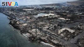 An aerial image taken on August 10, 2023 shows destroyed homes and buildings on the waterfront burned to the ground in Lahaina in the aftermath of wildfires in western Maui, Hawaii. (Photo by Patrick T. Fallon / AFP)