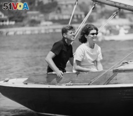 Democratic presidential nominee Sen. John F. Kennedy and wife Jacqueline in cockpit of their sailboat, Victura at Hyannis Port, Mass., Aug. 7, 1960.
