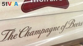 In this image provided by Comite Champagne, a label on the side of a carton of Miller High Life beer at the Westlandia plant in Ypres, Belgium on April 17, 2023. (Comite Champagne via AP)